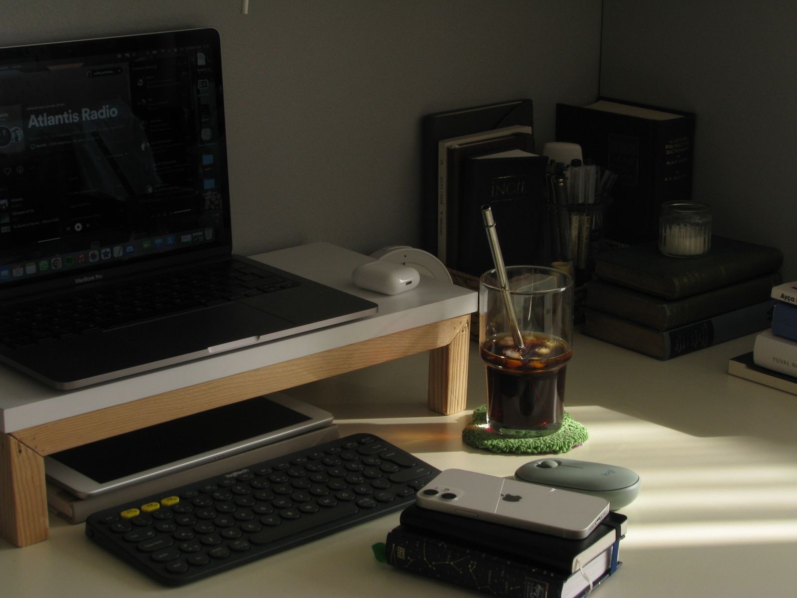 Office desk with a laptop, a stack of envelopes and a document scanner