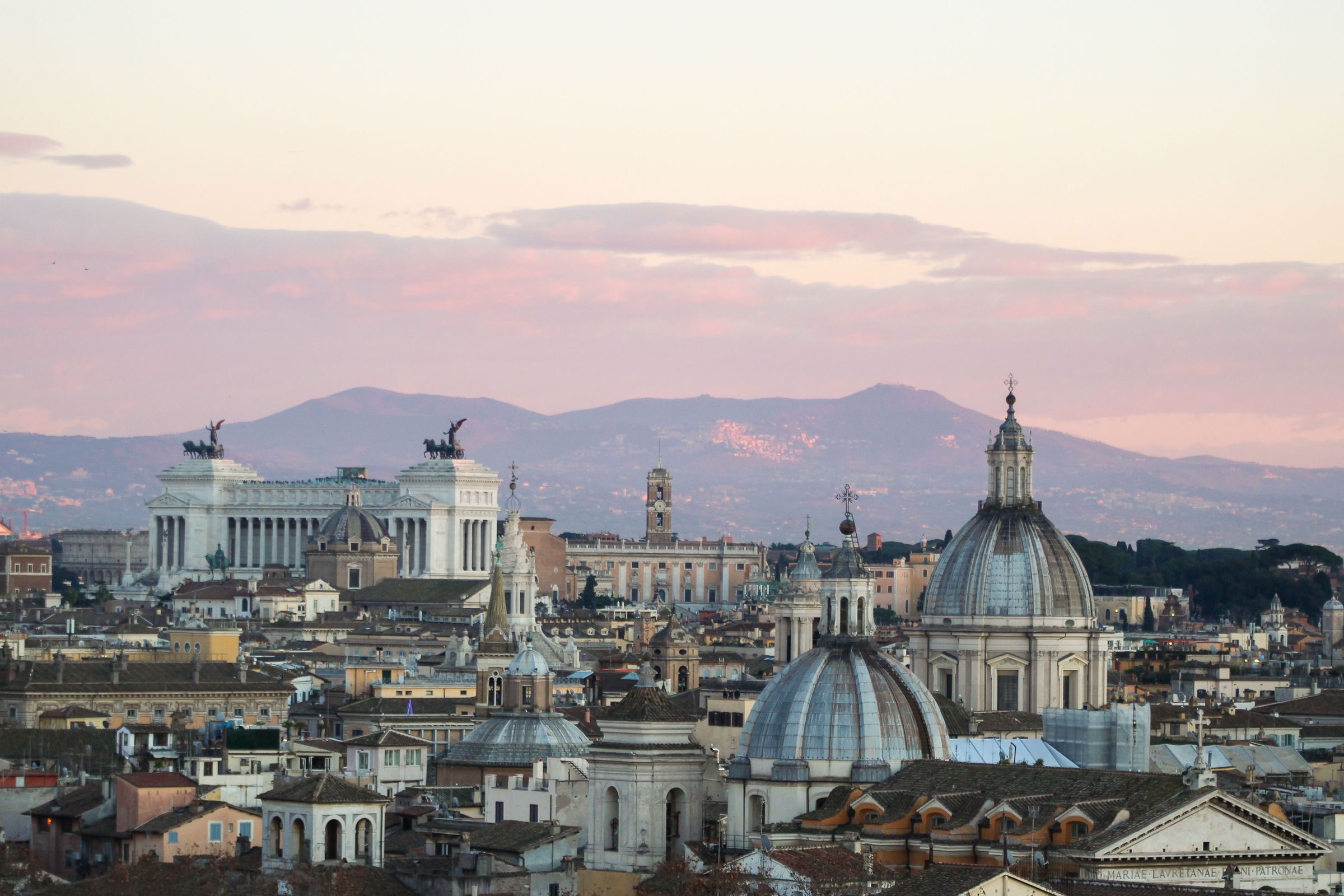Rooftops and domes of Rome at dusk